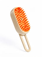 SteamPaw hydrating mist grooming brush for dogs and cats, orange, with silicone bristles